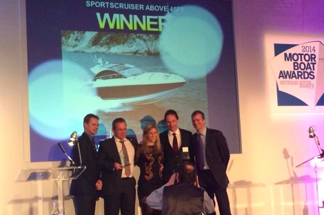 The Sunseeker International team, including Sales Director Sean Robertson (2nd from L), collect the award for "best sportscruiser over 45ft" won by the San Remo