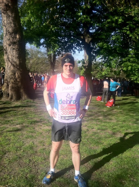 James Baker dons his DEBRA charity vest and Sunseeker London bandana ahead of Sunday's London Marathon