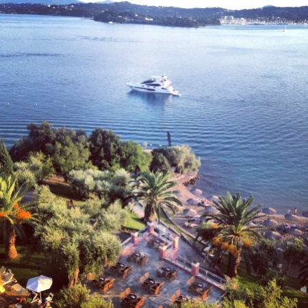 The 75 Yacht "FINEZZA" pictured the morning of the event, with beautifully still waters and the stunning Corfu Imperial Hotel nearby