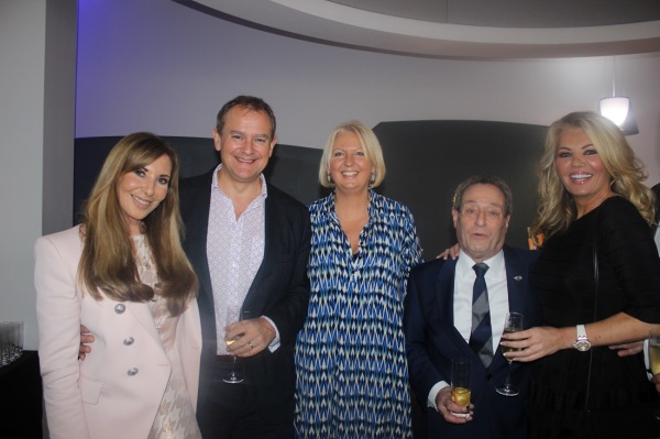 Alexis Lewis, Hugh and Lulu Bonneville, David Lewis and Claire Caudwell pause for a photo at the Sunseeker London Christmas Party 